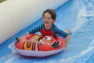 Ilminster Town FC fun day Part 17 – July 9, 2016: A giant water slide was the star attraction at a family fun day held to celebrate Ilminster Town Football Club’s new Archie Gooch Pavilion headquarters in Britten’s Field. Photo 30