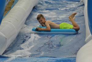 Ilminster Town FC fun day Part 17 – July 9, 2016: A giant water slide was the star attraction at a family fun day held to celebrate Ilminster Town Football Club’s new Archie Gooch Pavilion headquarters in Britten’s Field. Photo 5