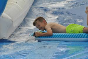 Ilminster Town FC fun day Part 17 – July 9, 2016: A giant water slide was the star attraction at a family fun day held to celebrate Ilminster Town Football Club’s new Archie Gooch Pavilion headquarters in Britten’s Field. Photo 6