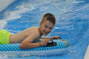 Ilminster Town FC fun day Part 17 – July 9, 2016: A giant water slide was the star attraction at a family fun day held to celebrate Ilminster Town Football Club’s new Archie Gooch Pavilion headquarters in Britten’s Field. Photo 7
