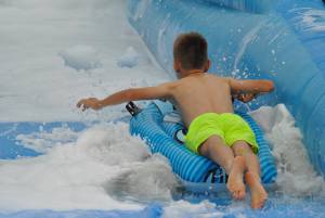 Ilminster Town FC fun day Part 17 – July 9, 2016: A giant water slide was the star attraction at a family fun day held to celebrate Ilminster Town Football Club’s new Archie Gooch Pavilion headquarters in Britten’s Field. Photo 8