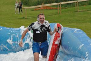 Ilminster Town FC fun day Part 18 – July 9, 2016: A giant water slide was the star attraction at a family fun day held to celebrate Ilminster Town Football Club’s new Archie Gooch Pavilion headquarters in Britten’s Field. Photo 11