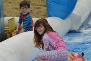 Ilminster Town FC fun day Part 18 – July 9, 2016: A giant water slide was the star attraction at a family fun day held to celebrate Ilminster Town Football Club’s new Archie Gooch Pavilion headquarters in Britten’s Field. Photo 13