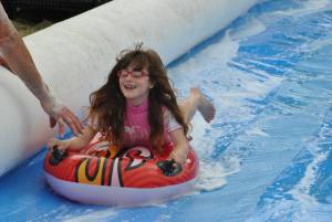 Ilminster Town FC fun day Part 18 – July 9, 2016: A giant water slide was the star attraction at a family fun day held to celebrate Ilminster Town Football Club’s new Archie Gooch Pavilion headquarters in Britten’s Field. Photo 14