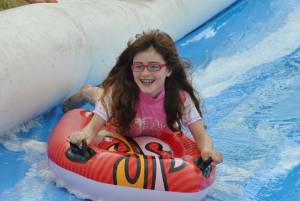 Ilminster Town FC fun day Part 18 – July 9, 2016: A giant water slide was the star attraction at a family fun day held to celebrate Ilminster Town Football Club’s new Archie Gooch Pavilion headquarters in Britten’s Field. Photo 15
