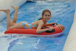 Ilminster Town FC fun day Part 18 – July 9, 2016: A giant water slide was the star attraction at a family fun day held to celebrate Ilminster Town Football Club’s new Archie Gooch Pavilion headquarters in Britten’s Field. Photo 16