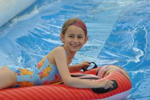 Ilminster Town FC fun day Part 18 – July 9, 2016: A giant water slide was the star attraction at a family fun day held to celebrate Ilminster Town Football Club’s new Archie Gooch Pavilion headquarters in Britten’s Field. Photo 17