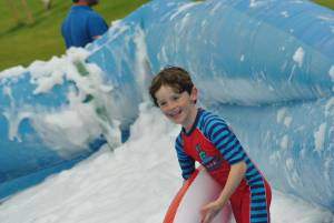 Ilminster Town FC fun day Part 18 – July 9, 2016: A giant water slide was the star attraction at a family fun day held to celebrate Ilminster Town Football Club’s new Archie Gooch Pavilion headquarters in Britten’s Field. Photo 1