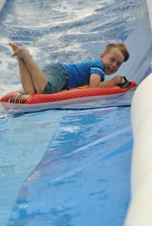 Ilminster Town FC fun day Part 18 – July 9, 2016: A giant water slide was the star attraction at a family fun day held to celebrate Ilminster Town Football Club’s new Archie Gooch Pavilion headquarters in Britten’s Field. Photo 20
