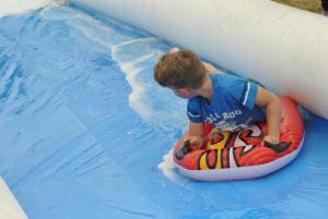 Ilminster Town FC fun day Part 18 – July 9, 2016: A giant water slide was the star attraction at a family fun day held to celebrate Ilminster Town Football Club’s new Archie Gooch Pavilion headquarters in Britten’s Field. Photo 23