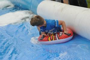 Ilminster Town FC fun day Part 18 – July 9, 2016: A giant water slide was the star attraction at a family fun day held to celebrate Ilminster Town Football Club’s new Archie Gooch Pavilion headquarters in Britten’s Field. Photo 24