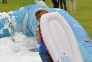 Ilminster Town FC fun day Part 18 – July 9, 2016: A giant water slide was the star attraction at a family fun day held to celebrate Ilminster Town Football Club’s new Archie Gooch Pavilion headquarters in Britten’s Field. Photo 26