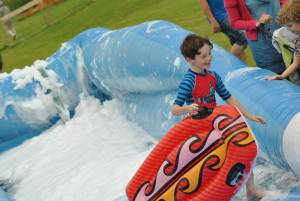 Ilminster Town FC fun day Part 18 – July 9, 2016: A giant water slide was the star attraction at a family fun day held to celebrate Ilminster Town Football Club’s new Archie Gooch Pavilion headquarters in Britten’s Field. Photo 2