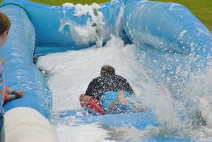 Ilminster Town FC fun day Part 18 – July 9, 2016: A giant water slide was the star attraction at a family fun day held to celebrate Ilminster Town Football Club’s new Archie Gooch Pavilion headquarters in Britten’s Field. Photo 8
