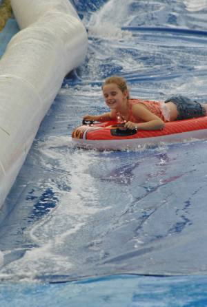 Ilminster Town FC fun day Part 19 – July 9, 2016: A giant water slide was the star attraction at a family fun day held to celebrate Ilminster Town Football Club’s new Archie Gooch Pavilion headquarters in Britten’s Field. Photo 16
