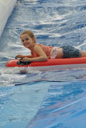 Ilminster Town FC fun day Part 19 – July 9, 2016: A giant water slide was the star attraction at a family fun day held to celebrate Ilminster Town Football Club’s new Archie Gooch Pavilion headquarters in Britten’s Field. Photo 17