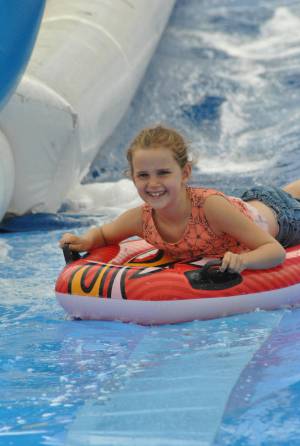 Ilminster Town FC fun day Part 19 – July 9, 2016: A giant water slide was the star attraction at a family fun day held to celebrate Ilminster Town Football Club’s new Archie Gooch Pavilion headquarters in Britten’s Field. Photo 18