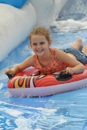 Ilminster Town FC fun day Part 19 – July 9, 2016: A giant water slide was the star attraction at a family fun day held to celebrate Ilminster Town Football Club’s new Archie Gooch Pavilion headquarters in Britten’s Field. Photo 19