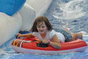 Ilminster Town FC fun day Part 19 – July 9, 2016: A giant water slide was the star attraction at a family fun day held to celebrate Ilminster Town Football Club’s new Archie Gooch Pavilion headquarters in Britten’s Field. Photo 21