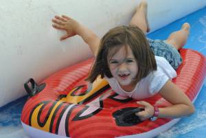 Ilminster Town FC fun day Part 19 – July 9, 2016: A giant water slide was the star attraction at a family fun day held to celebrate Ilminster Town Football Club’s new Archie Gooch Pavilion headquarters in Britten’s Field. Photo 22