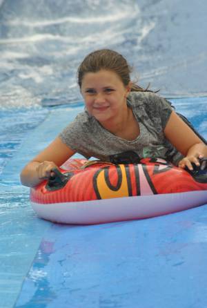 Ilminster Town FC fun day Part 19 – July 9, 2016: A giant water slide was the star attraction at a family fun day held to celebrate Ilminster Town Football Club’s new Archie Gooch Pavilion headquarters in Britten’s Field. Photo 24