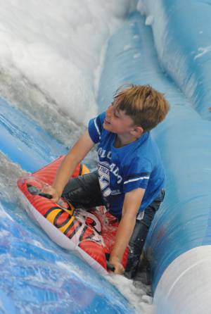 Ilminster Town FC fun day Part 19 – July 9, 2016: A giant water slide was the star attraction at a family fun day held to celebrate Ilminster Town Football Club’s new Archie Gooch Pavilion headquarters in Britten’s Field. Photo 26