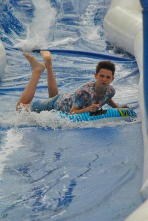 Ilminster Town FC fun day Part 19 – July 9, 2016: A giant water slide was the star attraction at a family fun day held to celebrate Ilminster Town Football Club’s new Archie Gooch Pavilion headquarters in Britten’s Field. Photo 27