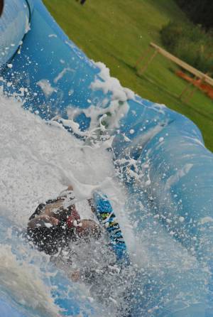 Ilminster Town FC fun day Part 19 – July 9, 2016: A giant water slide was the star attraction at a family fun day held to celebrate Ilminster Town Football Club’s new Archie Gooch Pavilion headquarters in Britten’s Field. Photo 2
