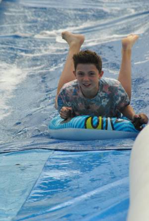 Ilminster Town FC fun day Part 19 – July 9, 2016: A giant water slide was the star attraction at a family fun day held to celebrate Ilminster Town Football Club’s new Archie Gooch Pavilion headquarters in Britten’s Field. Photo 28