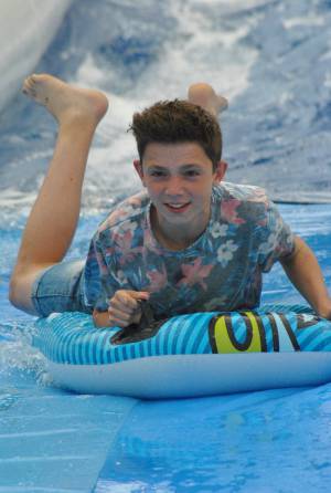 Ilminster Town FC fun day Part 19 – July 9, 2016: A giant water slide was the star attraction at a family fun day held to celebrate Ilminster Town Football Club’s new Archie Gooch Pavilion headquarters in Britten’s Field. Photo 29