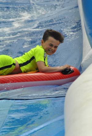 Ilminster Town FC fun day Part 20 – July 9, 2016: A giant water slide was the star attraction at a family fun day held to celebrate Ilminster Town Football Club’s new Archie Gooch Pavilion headquarters in Britten’s Field. Photo 10
