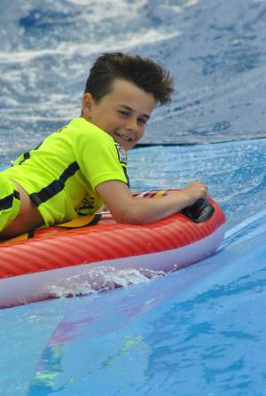Ilminster Town FC fun day Part 20 – July 9, 2016: A giant water slide was the star attraction at a family fun day held to celebrate Ilminster Town Football Club’s new Archie Gooch Pavilion headquarters in Britten’s Field. Photo 11