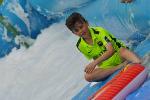Ilminster Town FC fun day Part 20 – July 9, 2016: A giant water slide was the star attraction at a family fun day held to celebrate Ilminster Town Football Club’s new Archie Gooch Pavilion headquarters in Britten’s Field. Photo 13