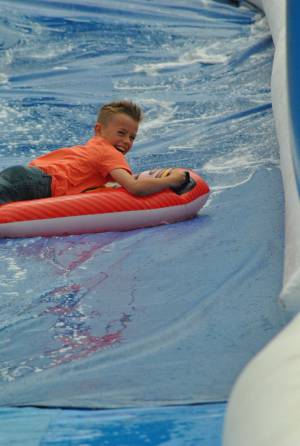 Ilminster Town FC fun day Part 20 – July 9, 2016: A giant water slide was the star attraction at a family fun day held to celebrate Ilminster Town Football Club’s new Archie Gooch Pavilion headquarters in Britten’s Field. Photo 14