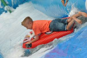 Ilminster Town FC fun day Part 20 – July 9, 2016: A giant water slide was the star attraction at a family fun day held to celebrate Ilminster Town Football Club’s new Archie Gooch Pavilion headquarters in Britten’s Field. Photo 15