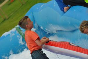 Ilminster Town FC fun day Part 20 – July 9, 2016: A giant water slide was the star attraction at a family fun day held to celebrate Ilminster Town Football Club’s new Archie Gooch Pavilion headquarters in Britten’s Field. Photo 16