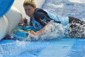 Ilminster Town FC fun day Part 20 – July 9, 2016: A giant water slide was the star attraction at a family fun day held to celebrate Ilminster Town Football Club’s new Archie Gooch Pavilion headquarters in Britten’s Field. Photo 17