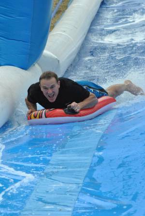 Ilminster Town FC fun day Part 20 – July 9, 2016: A giant water slide was the star attraction at a family fun day held to celebrate Ilminster Town Football Club’s new Archie Gooch Pavilion headquarters in Britten’s Field. Photo 1