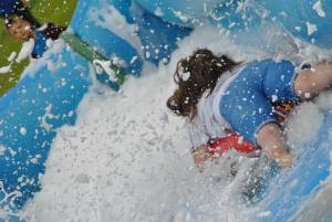 Ilminster Town FC fun day Part 20 – July 9, 2016: A giant water slide was the star attraction at a family fun day held to celebrate Ilminster Town Football Club’s new Archie Gooch Pavilion headquarters in Britten’s Field. Photo 28