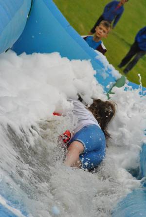 Ilminster Town FC fun day Part 20 – July 9, 2016: A giant water slide was the star attraction at a family fun day held to celebrate Ilminster Town Football Club’s new Archie Gooch Pavilion headquarters in Britten’s Field. Photo 29