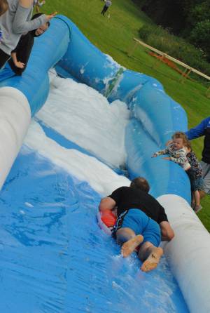 Ilminster Town FC fun day Part 20 – July 9, 2016: A giant water slide was the star attraction at a family fun day held to celebrate Ilminster Town Football Club’s new Archie Gooch Pavilion headquarters in Britten’s Field. Photo 3
