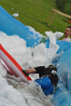 Ilminster Town FC fun day Part 20 – July 9, 2016: A giant water slide was the star attraction at a family fun day held to celebrate Ilminster Town Football Club’s new Archie Gooch Pavilion headquarters in Britten’s Field. Photo 6