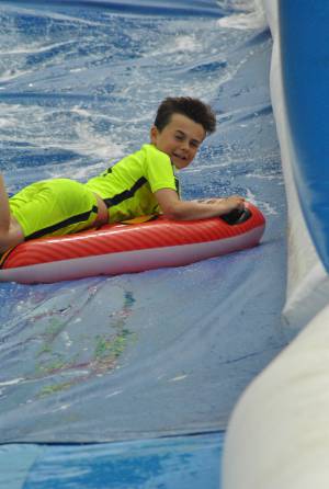 Ilminster Town FC fun day Part 20 – July 9, 2016: A giant water slide was the star attraction at a family fun day held to celebrate Ilminster Town Football Club’s new Archie Gooch Pavilion headquarters in Britten’s Field. Photo 9