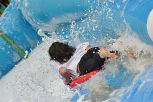 Ilminster Town FC fun day Part 21 – July 9, 2016: A giant water slide was the star attraction at a family fun day held to celebrate Ilminster Town Football Club’s new Archie Gooch Pavilion headquarters in Britten’s Field. Photo 13
