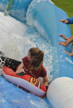 Ilminster Town FC fun day Part 21 – July 9, 2016: A giant water slide was the star attraction at a family fun day held to celebrate Ilminster Town Football Club’s new Archie Gooch Pavilion headquarters in Britten’s Field. Photo 16