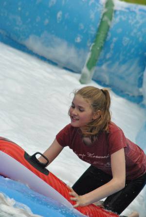 Ilminster Town FC fun day Part 21 – July 9, 2016: A giant water slide was the star attraction at a family fun day held to celebrate Ilminster Town Football Club’s new Archie Gooch Pavilion headquarters in Britten’s Field. Photo 17