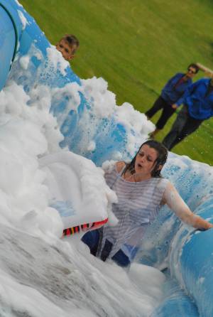 Ilminster Town FC fun day Part 21 – July 9, 2016: A giant water slide was the star attraction at a family fun day held to celebrate Ilminster Town Football Club’s new Archie Gooch Pavilion headquarters in Britten’s Field. Photo 1