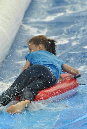 Ilminster Town FC fun day Part 21 – July 9, 2016: A giant water slide was the star attraction at a family fun day held to celebrate Ilminster Town Football Club’s new Archie Gooch Pavilion headquarters in Britten’s Field. Photo 21