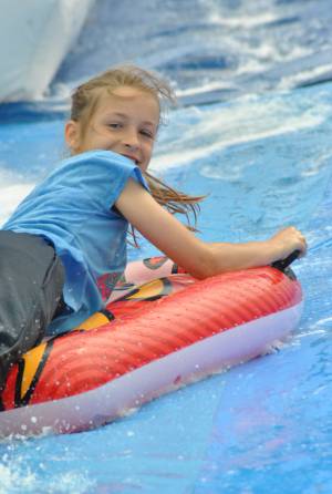 Ilminster Town FC fun day Part 21 – July 9, 2016: A giant water slide was the star attraction at a family fun day held to celebrate Ilminster Town Football Club’s new Archie Gooch Pavilion headquarters in Britten’s Field. Photo 22