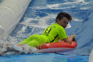 Ilminster Town FC fun day Part 21 – July 9, 2016: A giant water slide was the star attraction at a family fun day held to celebrate Ilminster Town Football Club’s new Archie Gooch Pavilion headquarters in Britten’s Field. Photo 24